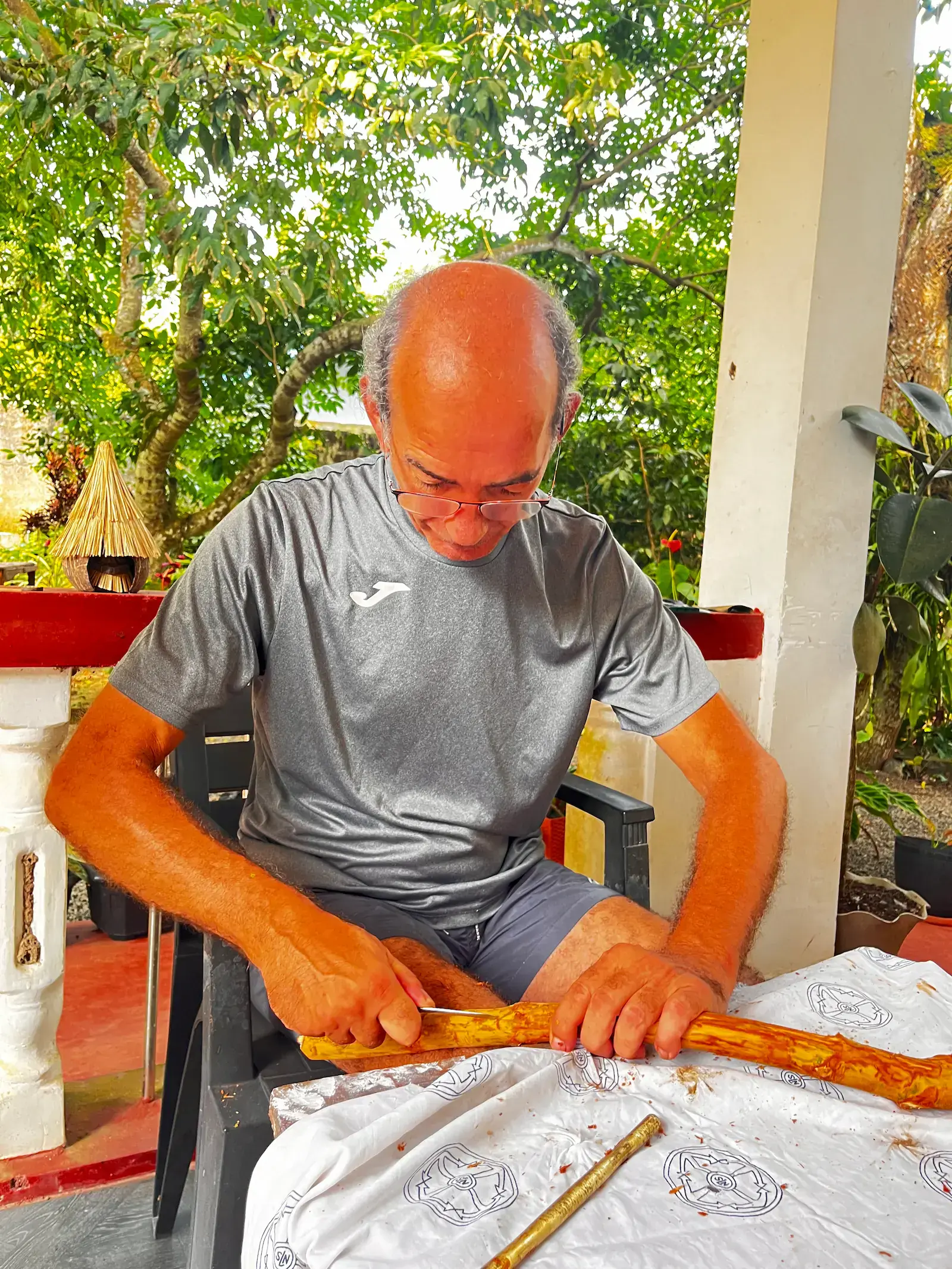 Guest carving a cinnamon stick during a local workshop in Sri Lanka