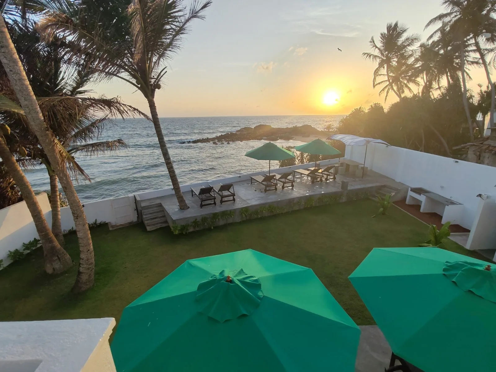 Stunning sunset sea view and beachfront garden at Villa One 64 Beachfront, Hikkaduwa