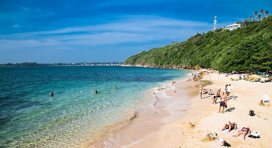 Clear crystal turquoise waters of Jungle Beach Unawatuna